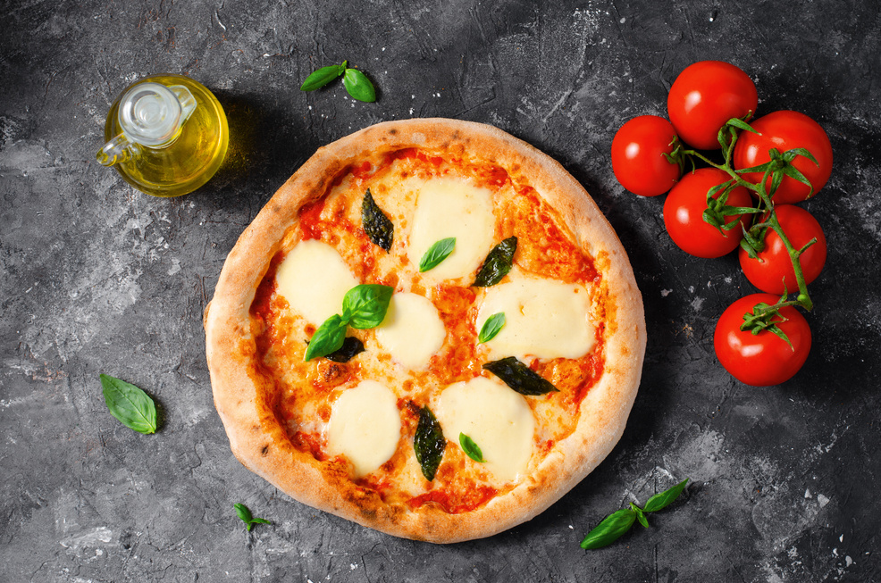 Italian Pizza Margherita with Mozzarella Cheese and Basil Leaves on Dark Background, Freshly Baked Pizza